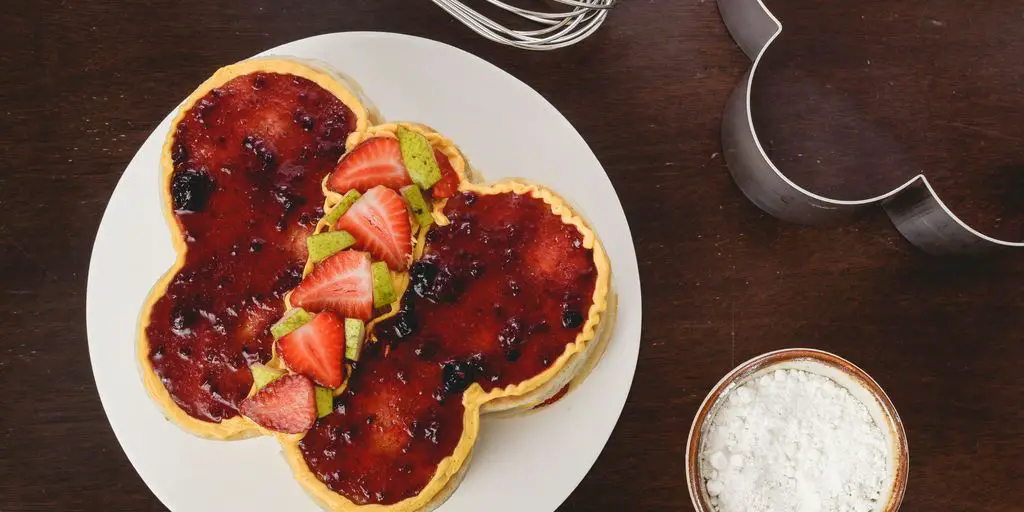 bread with strawberry jam and sliced strawberries